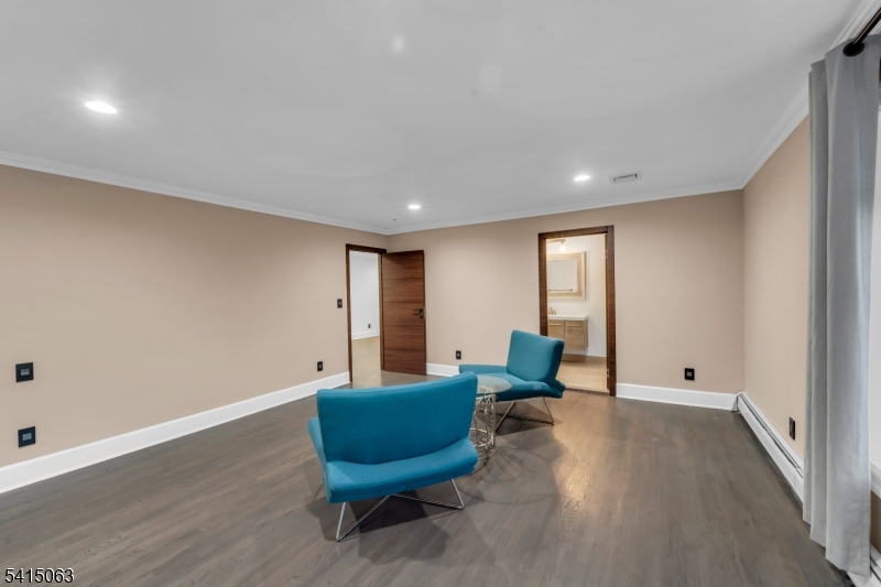 99 Ogle Road Old Tappan, NJ 07675 - Photo 30 of 35 a living room with furniture and a wooden floor