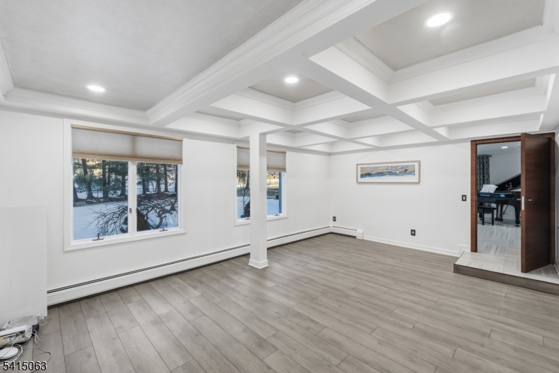 99 Ogle Road Old Tappan, NJ 07675 - Photo 3 of 35 an empty room with wooden floor and windows