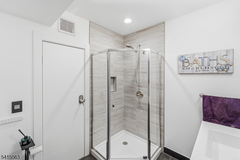 99 Ogle Road Old Tappan, NJ 07675 - Photo 33 of 35 a bathroom with a shower and a sink