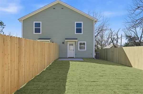 a view of a backyard of the house