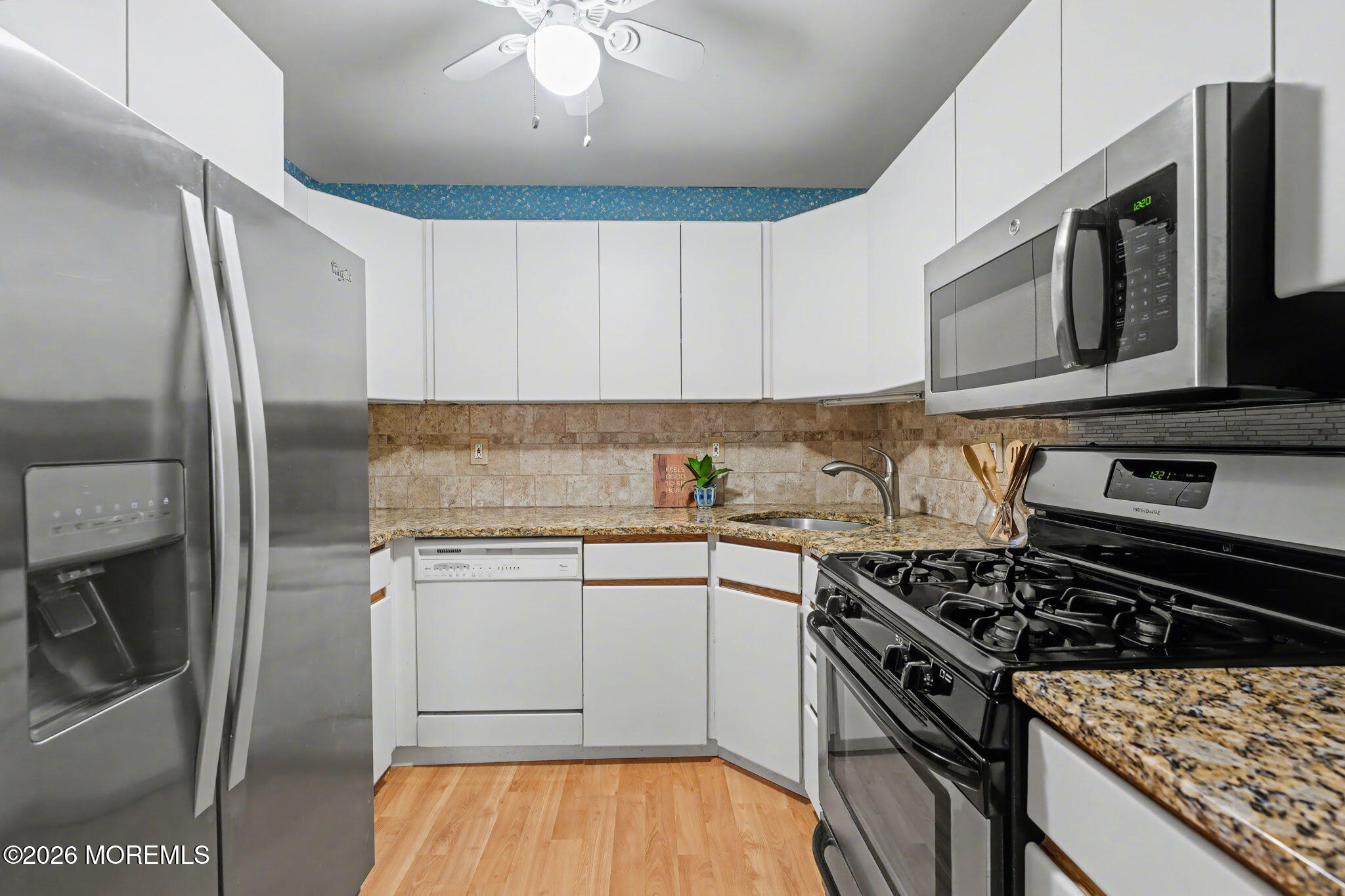 813 West Laurel Avenue Point Pleasant Beach, NJ 08742 - Photo 20 of 32 a kitchen with stainless steel appliances granite countertop a stove and a microwave