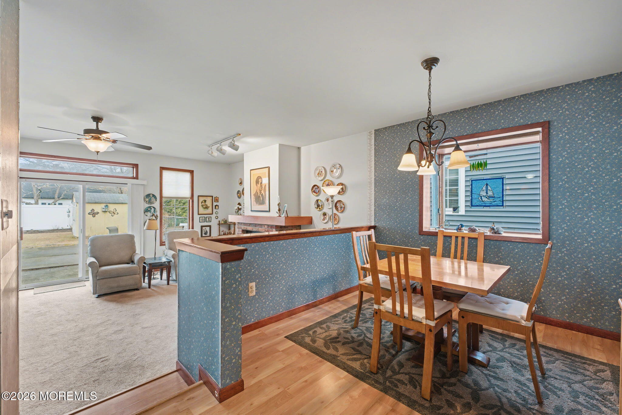 813 West Laurel Avenue Point Pleasant Beach, NJ 08742 - Photo 22 of 32 a dining room with furniture a chandelier and wooden floor