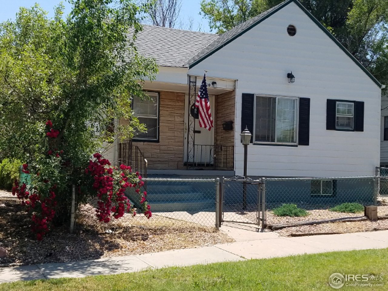 810 20th Street Greeley, CO 80631 - Photo 1 of 1 a front view of a house with a yard