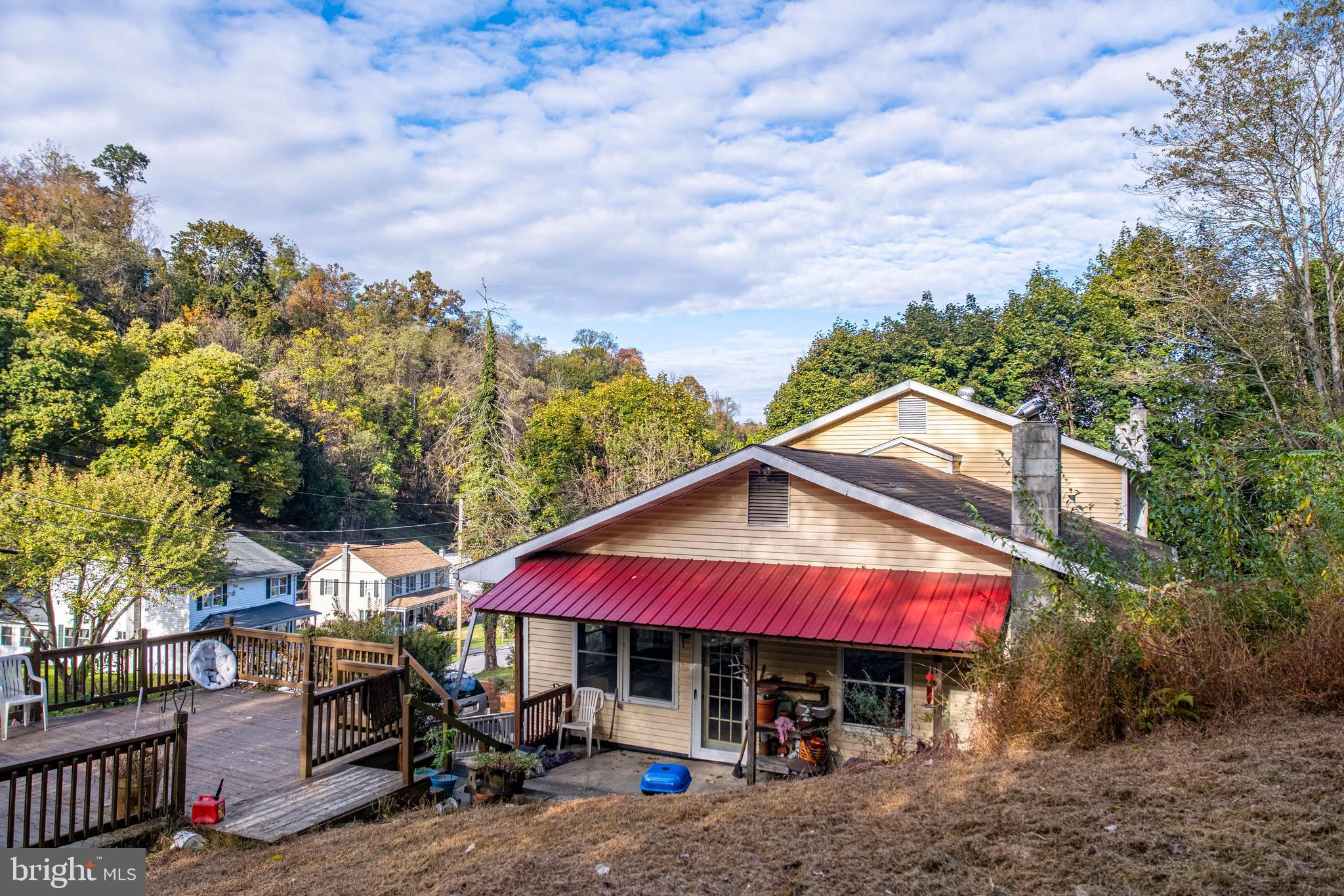 71 Woodbine Road Lewistown, PA 17044 - Photo 12 of 44 an outdoor space with patio and wooden benches