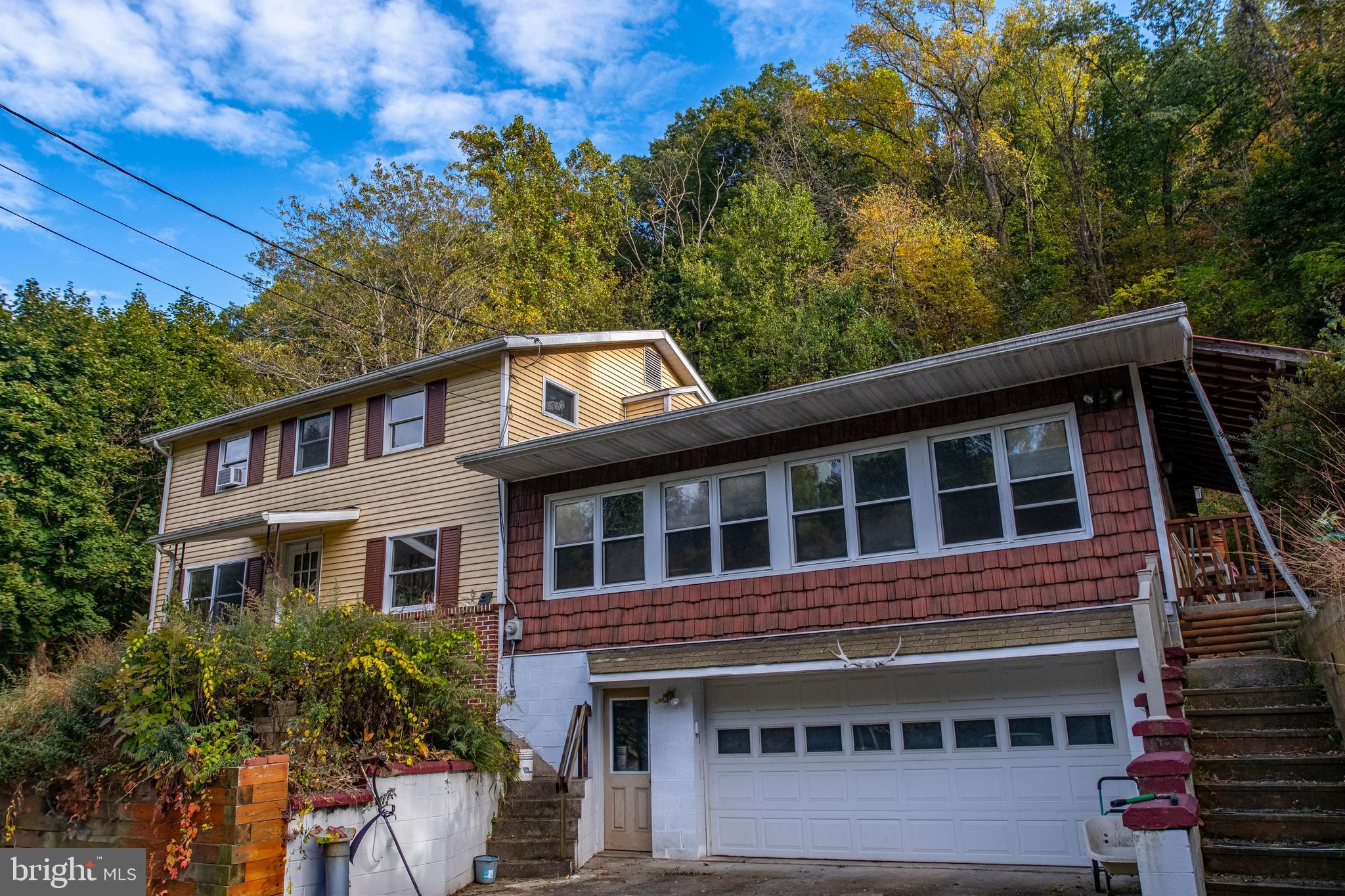 71 Woodbine Road Lewistown, PA 17044 - Photo 13 of 44 a front view of a house with a yard