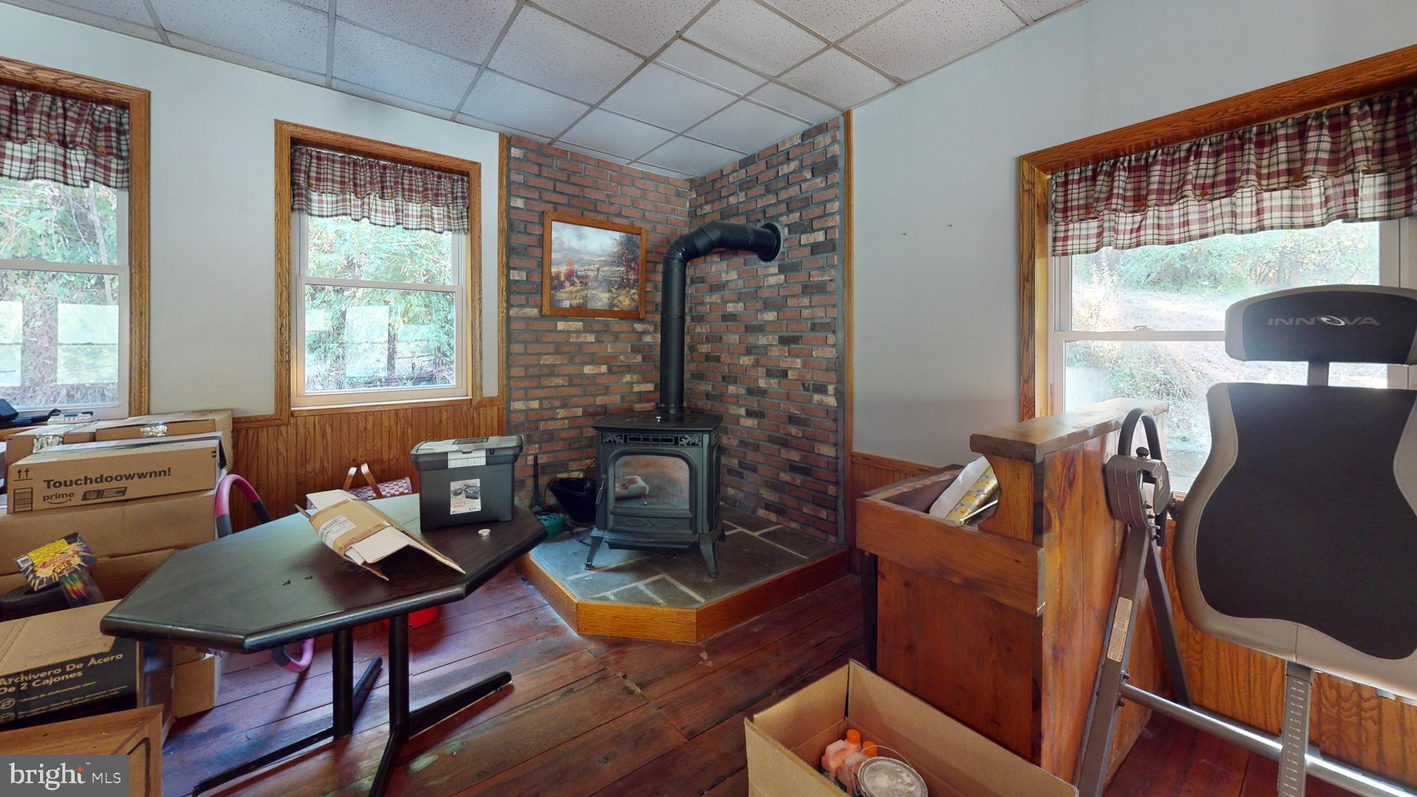 71 Woodbine Road Lewistown, PA 17044 - Photo 42 of 44 a living room with furniture a table and a large window