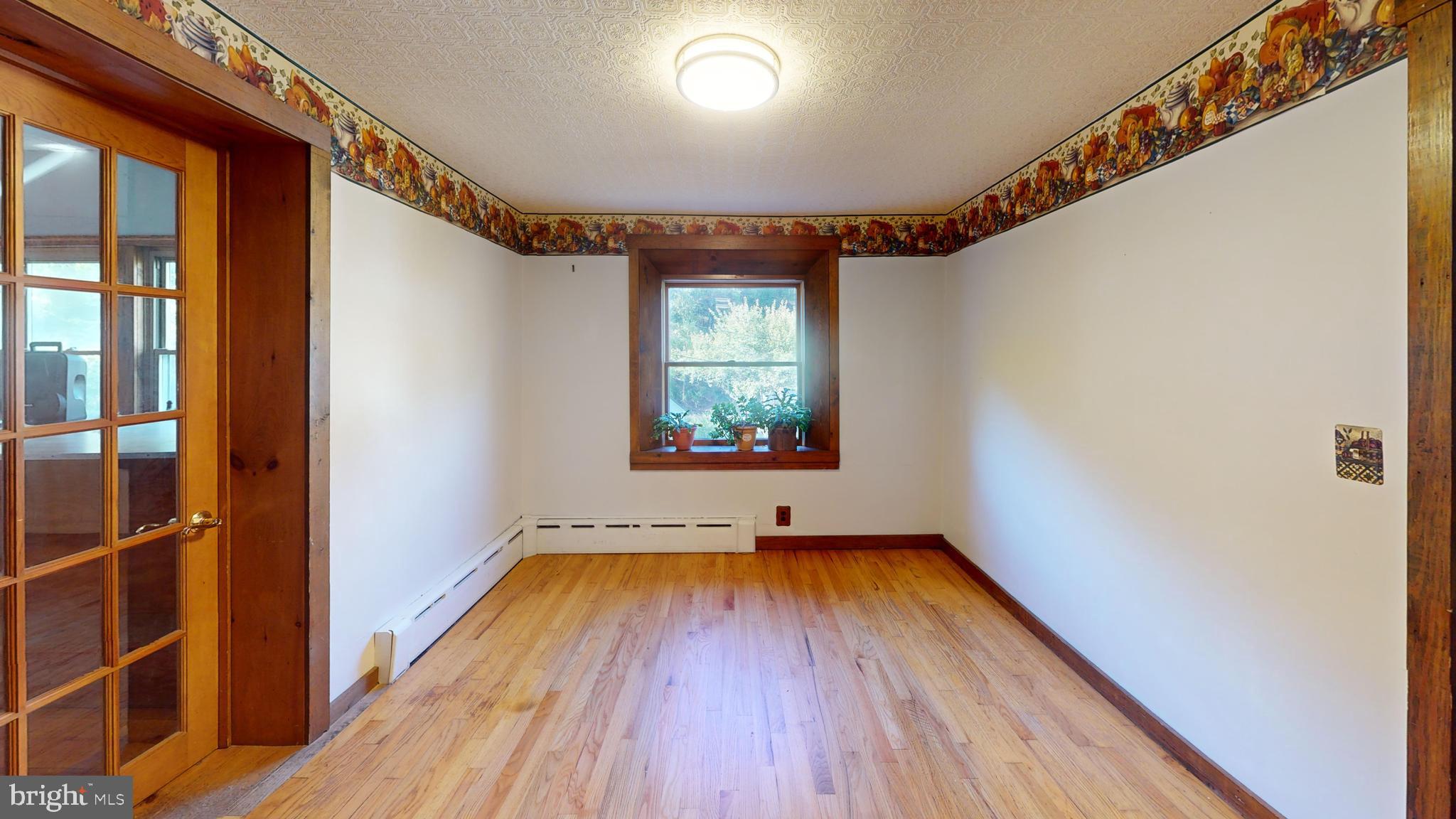 71 Woodbine Road Lewistown, PA 17044 - Photo 44 of 44 a view of empty room with wooden floor and fan