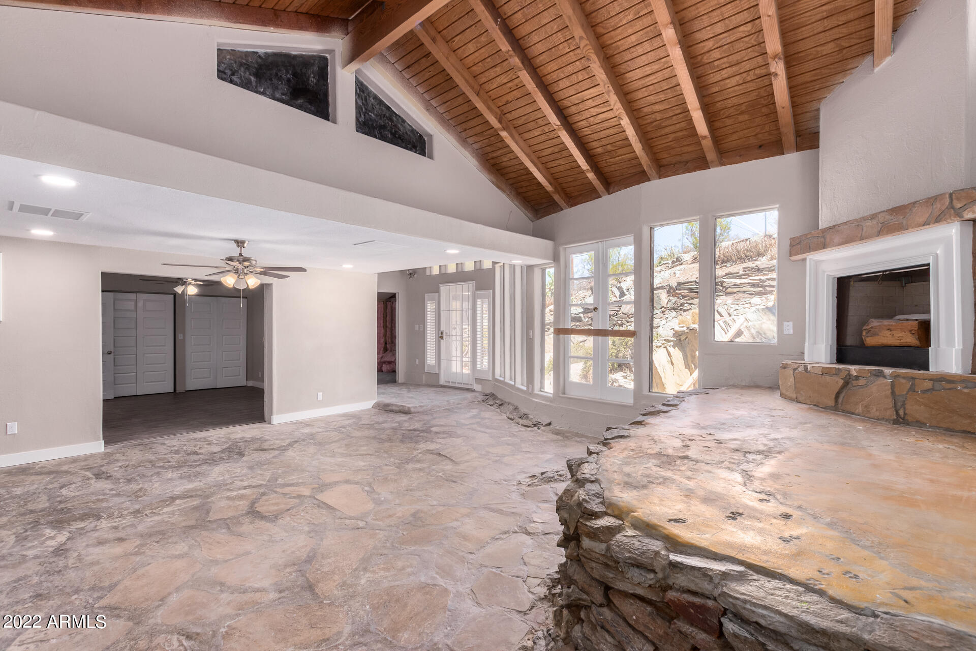 1036 East Butler Drive Phoenix, AZ 85020 - Photo 11 of 25 a view of a livingroom with wooden floor and a fireplace