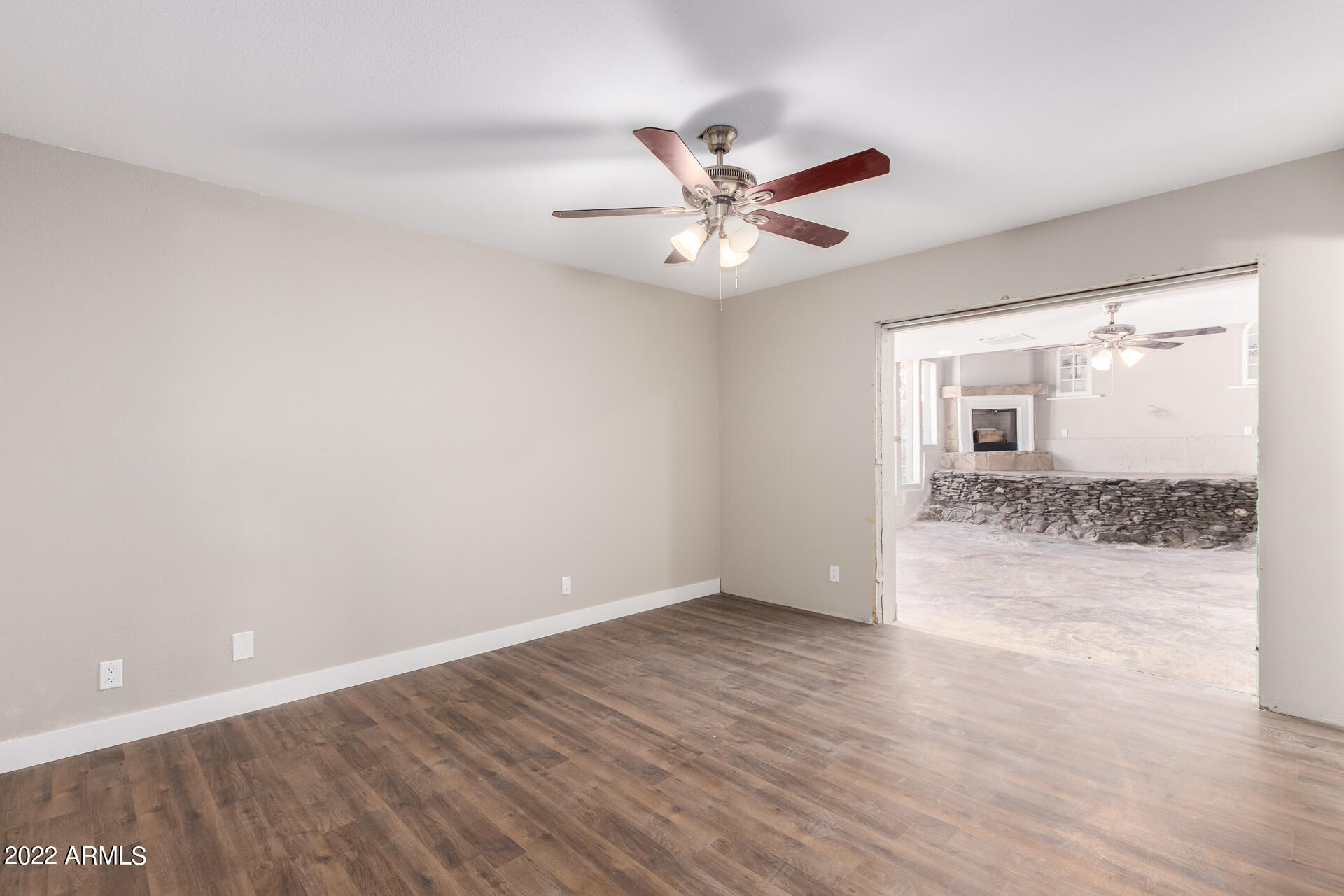 1036 East Butler Drive Phoenix, AZ 85020 - Photo 17 of 25 wooden floor in an empty room with a window