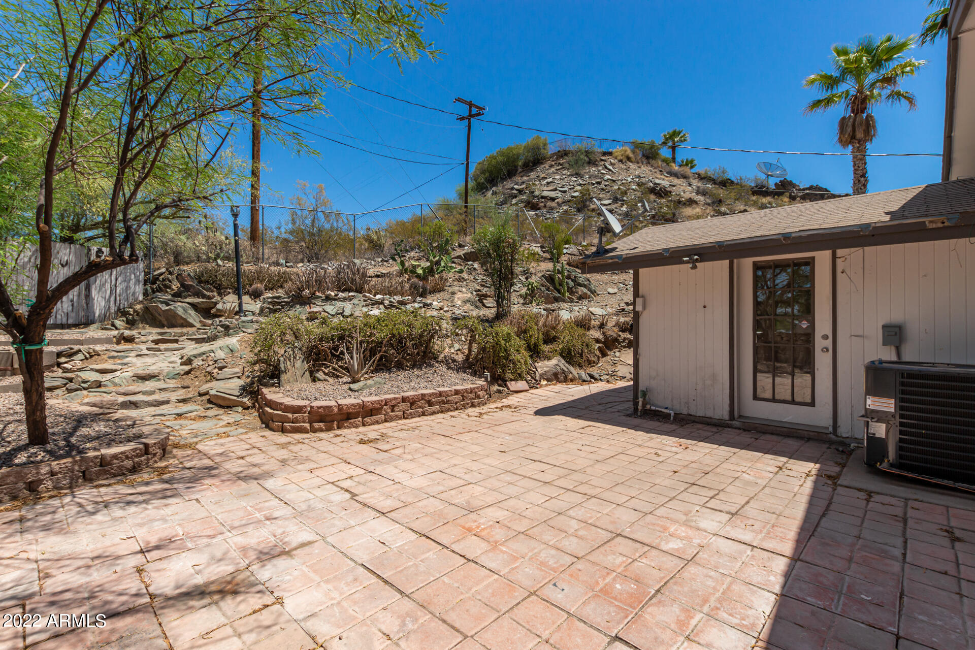 1036 East Butler Drive Phoenix, AZ 85020 - Photo 20 of 25 a view of a house with a snow on the road