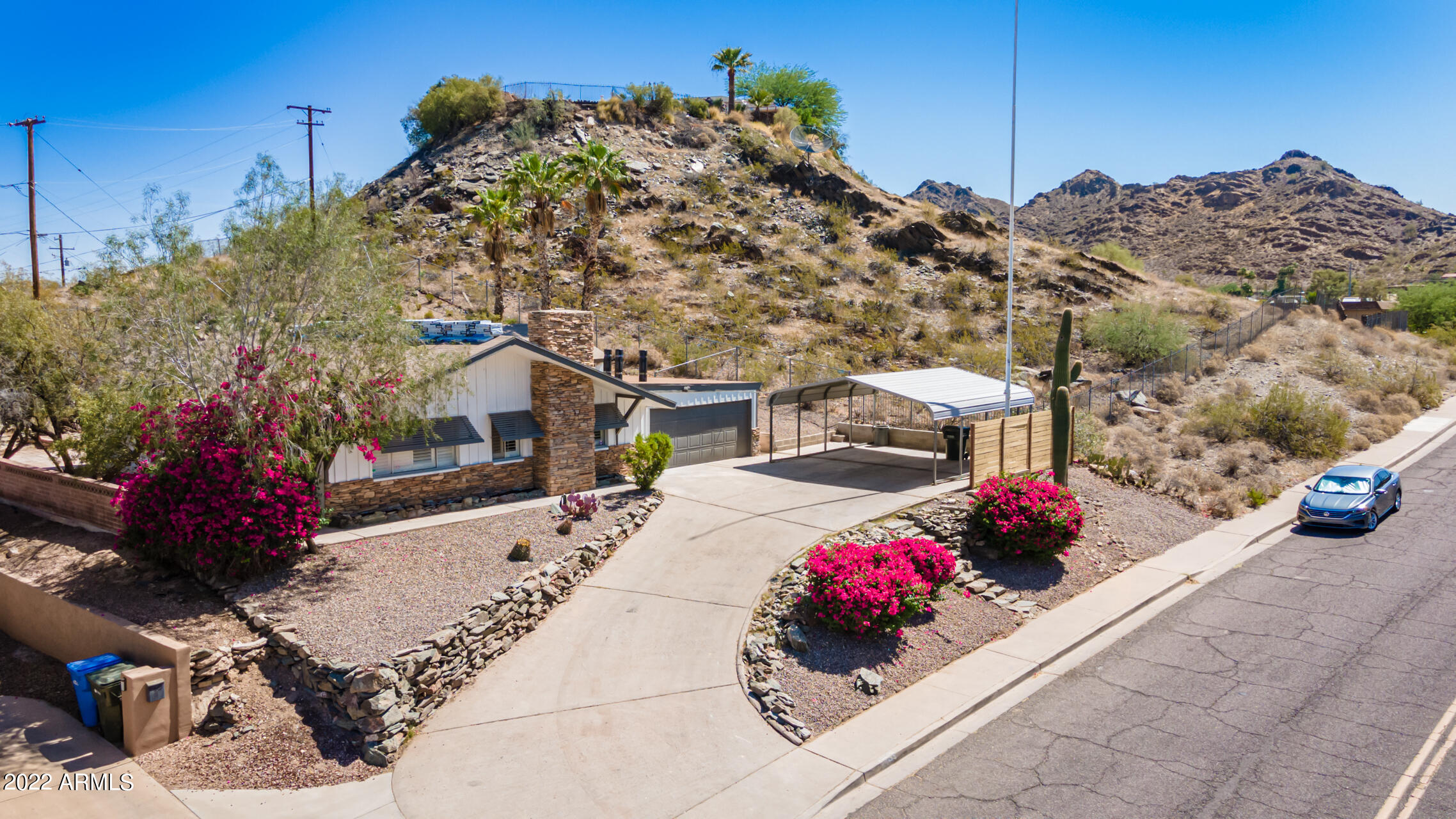 1036 East Butler Drive Phoenix, AZ 85020 - Photo 21 of 25 a building view with a flower garden
