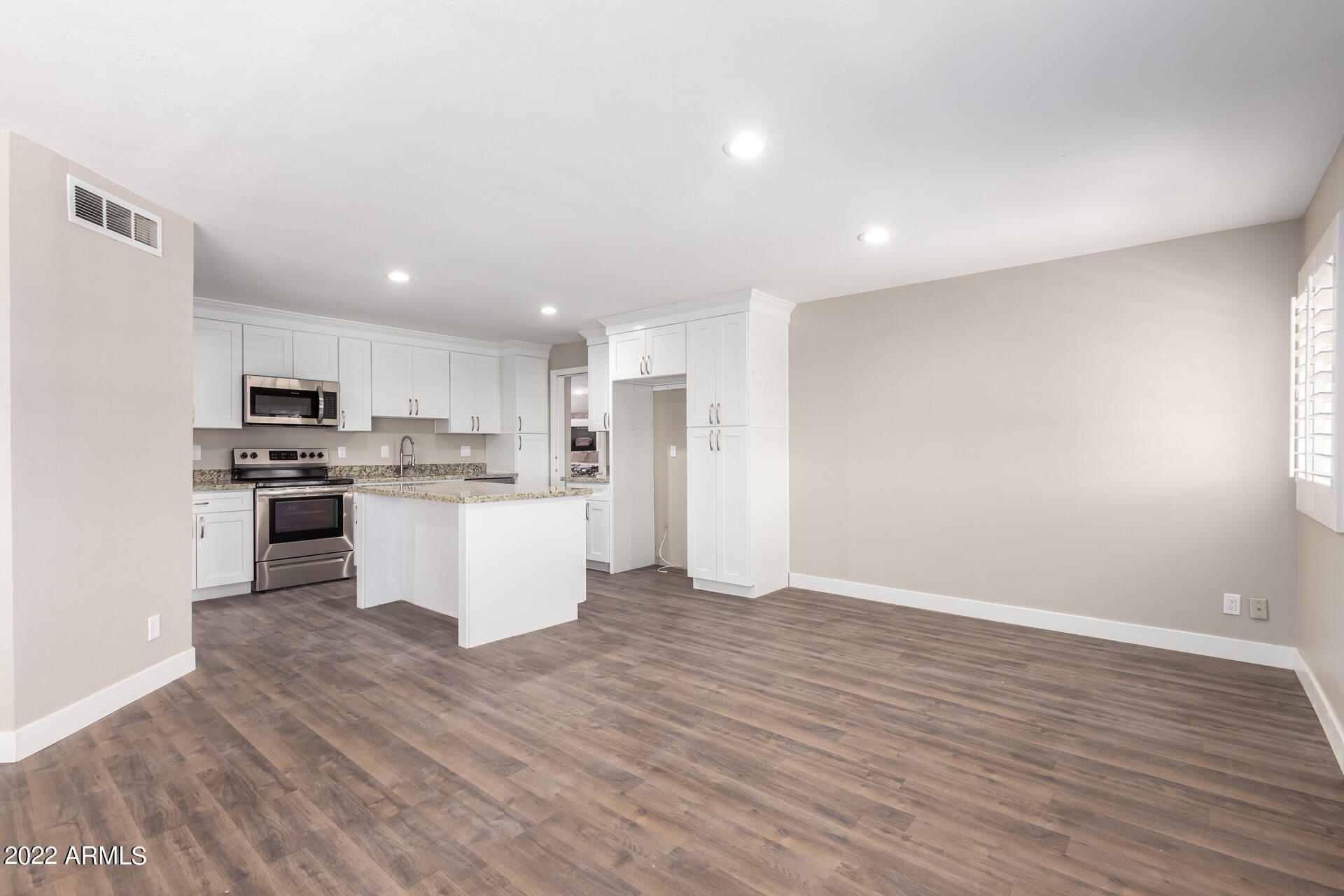 1036 East Butler Drive Phoenix, AZ 85020 - Photo 4 of 25 a view of kitchen with wooden floor