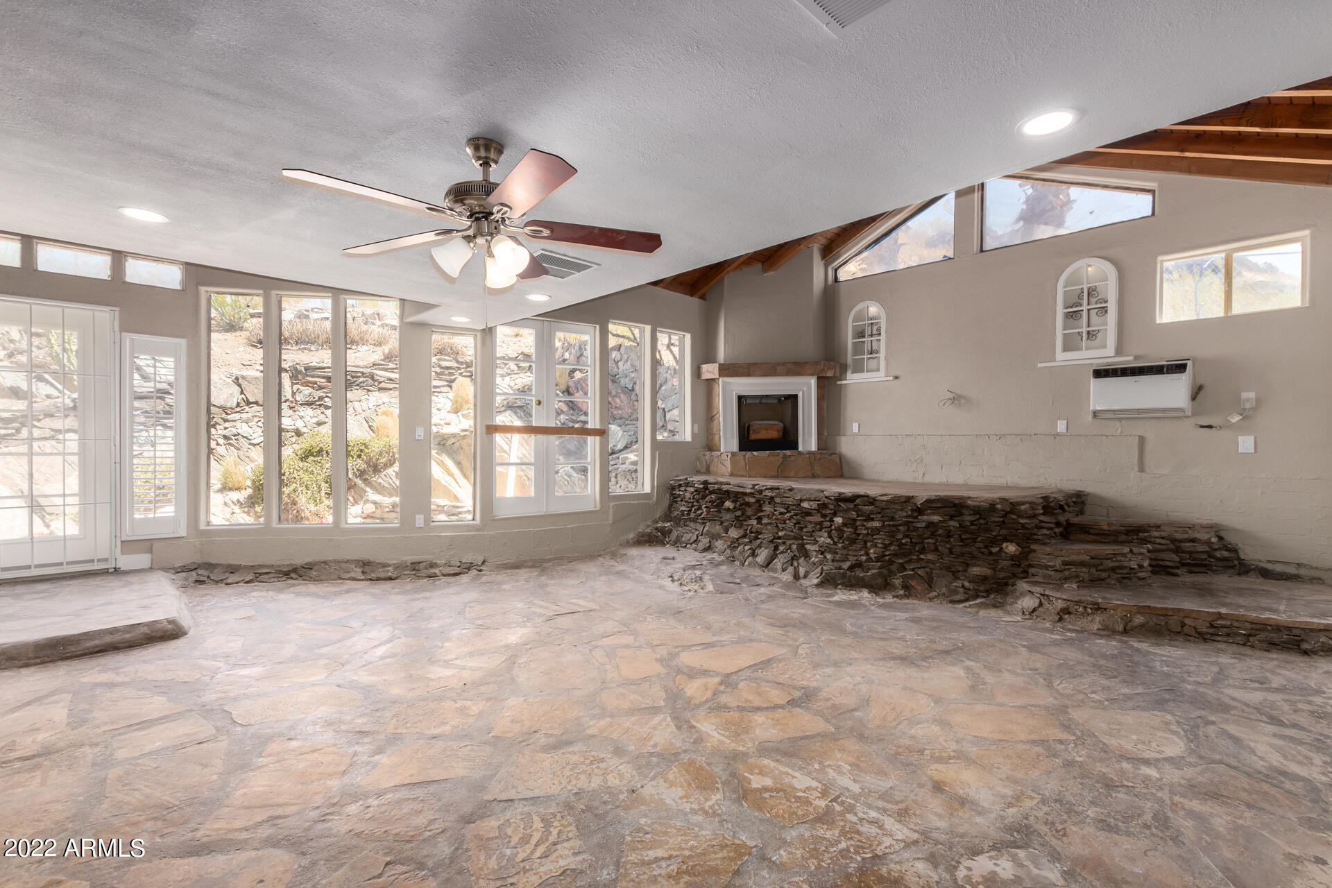 1036 East Butler Drive Phoenix, AZ 85020 - Photo 9 of 25 a view of a livingroom with a ceiling fan and window