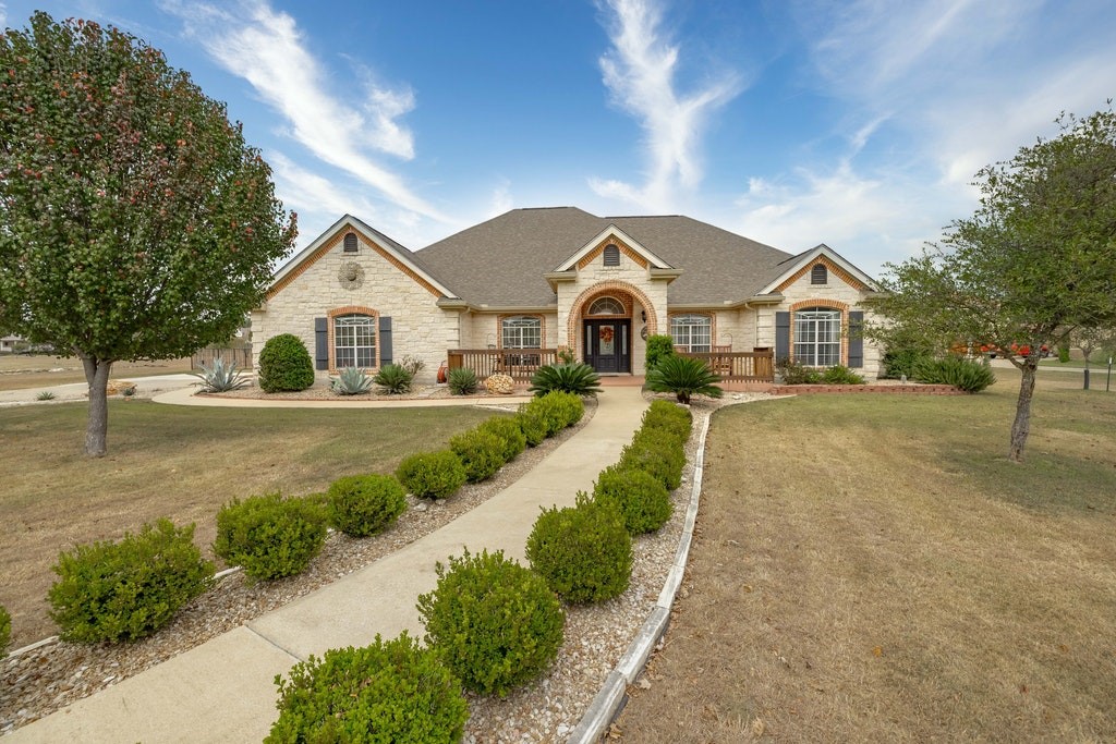 164 Waterford Lane Georgetown, TX 78628 - Photo 1 of 1 a front view of a house with a yard and trees