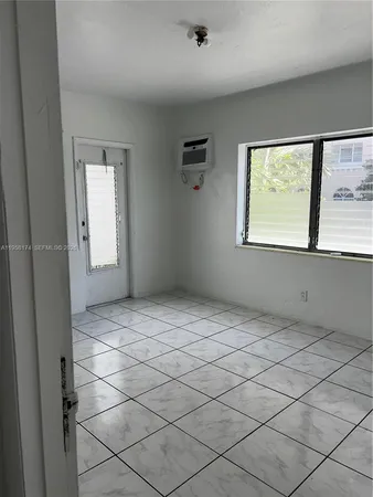 a view of a pathway of a house with wooden floor