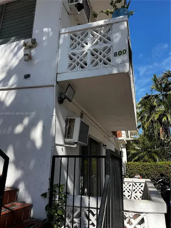 a view of balcony with seating space and wooden floor