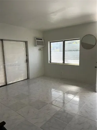 a kitchen with stainless steel appliances a refrigerator and a stove