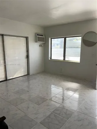 a view of a storage and utility room with a fan