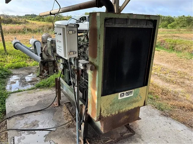 a view of a chairs and table in patio