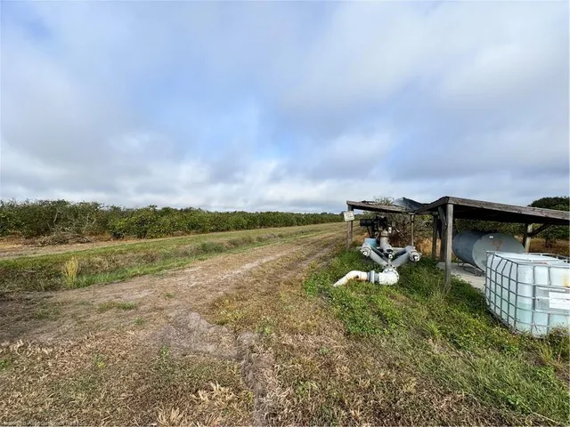 a view of a lake with a yard