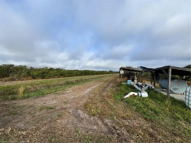 a view of a lake with houses in the background