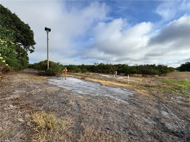 a view of a lake with houses in the back
