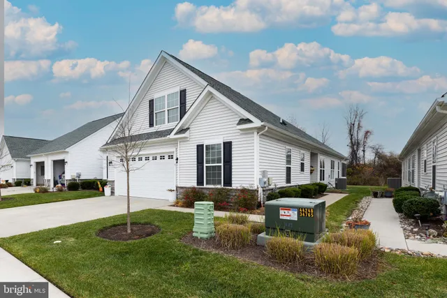 a kitchen with granite countertop a stove refrigerator and microwave