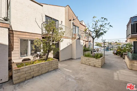 a front view of a house with fountain