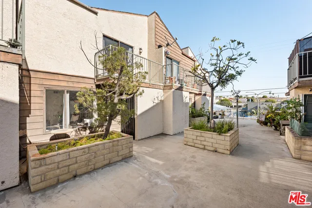 a front view of a house with fountain