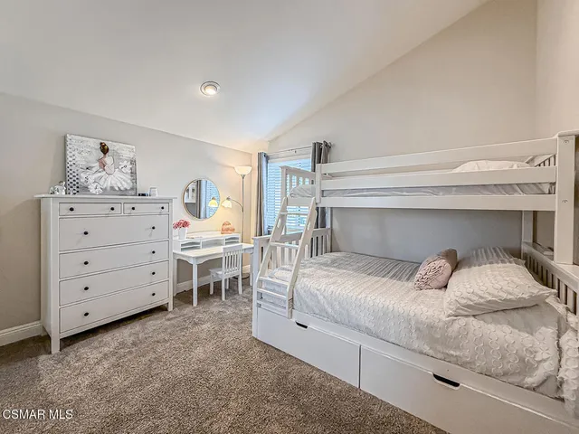 a view of a livingroom with furniture staircase and a living room