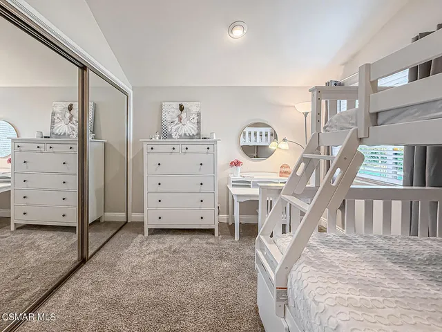 a bathroom with a granite countertop sink a toilet a mirror a vanity a bathtub and shower