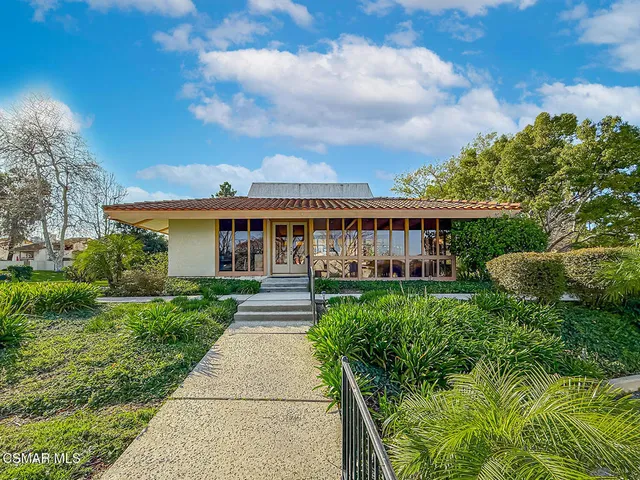 a view of swimming pool with seating space