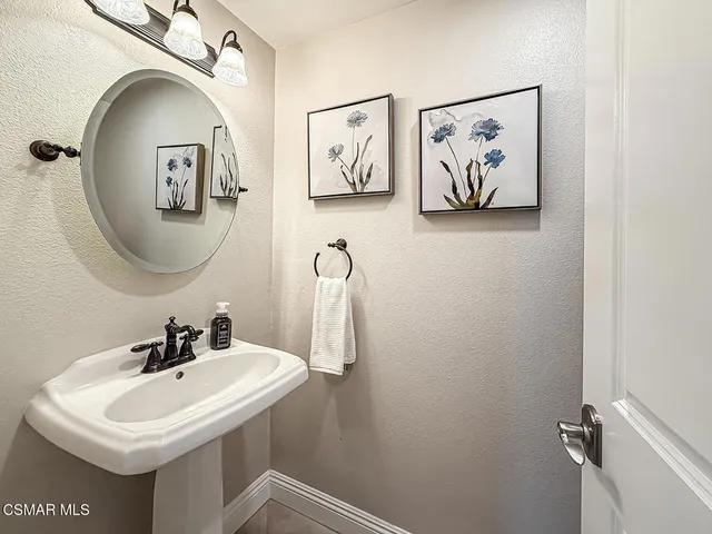 a bathroom with a sink and mirror