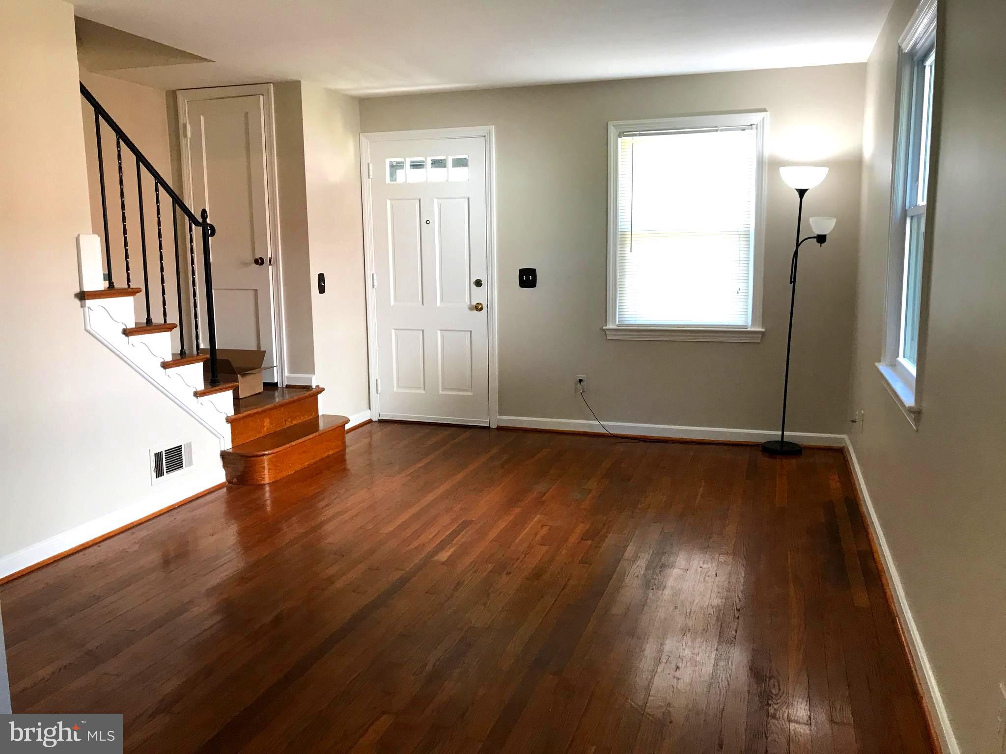 11939 Bluhill Road Silver Spring, MD 20902 - Photo 4 of 17 Large and bright living room with hardwood floors