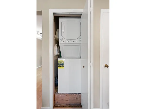 a view of parking garage with cars parked