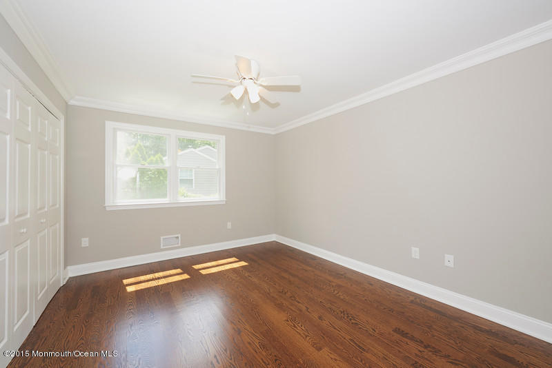 82 Kings Road Little Silver, NJ 07739 - Photo 11 of 19 wooden floor in an empty room with a window