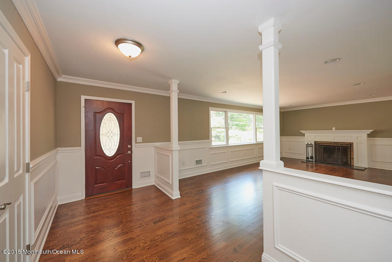 82 Kings Road Little Silver, NJ 07739 - Photo 3 of 19 a view of an empty room with a window and wooden floor