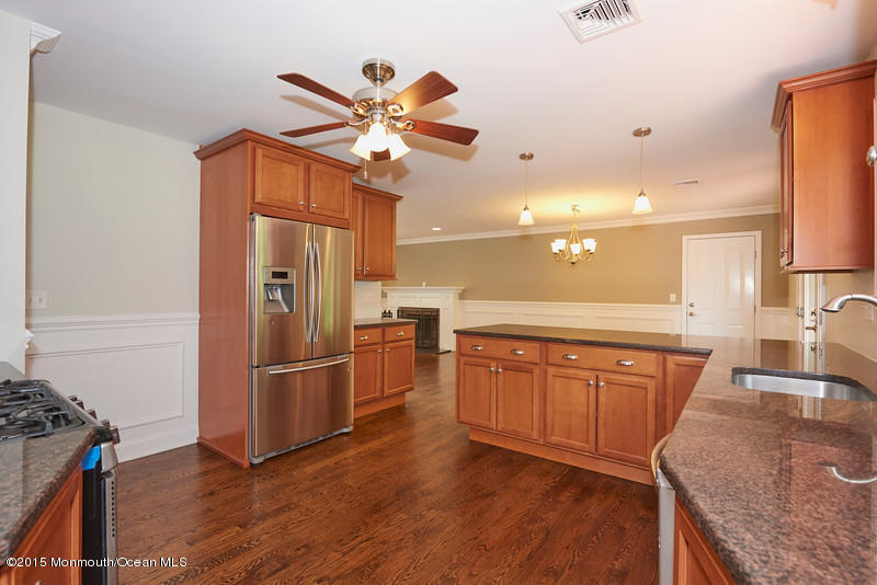 82 Kings Road Little Silver, NJ 07739 - Photo 7 of 19 a kitchen with stainless steel appliances granite countertop a refrigerator a sink dishwasher and a stove with wooden floor