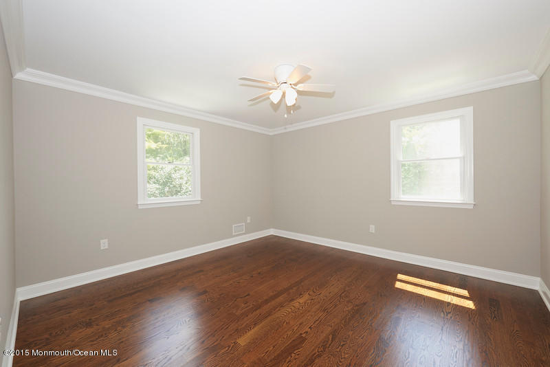 82 Kings Road Little Silver, NJ 07739 - Photo 10 of 19 wooden floor in an empty room with a window