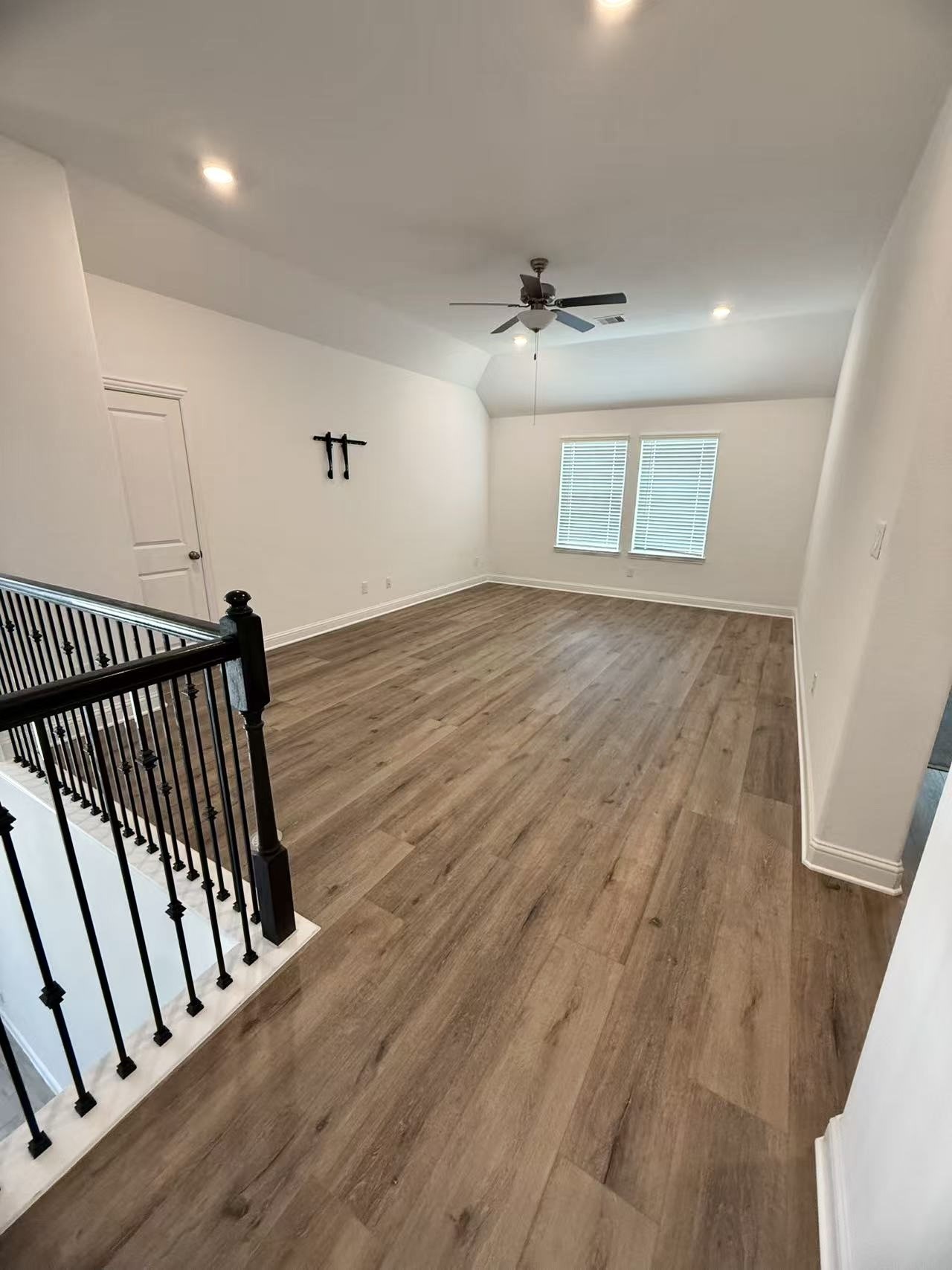 29806 Cherry Vine Road Katy, TX 77494 - Photo 19 of 30 a view of staircase with wooden floor and fan