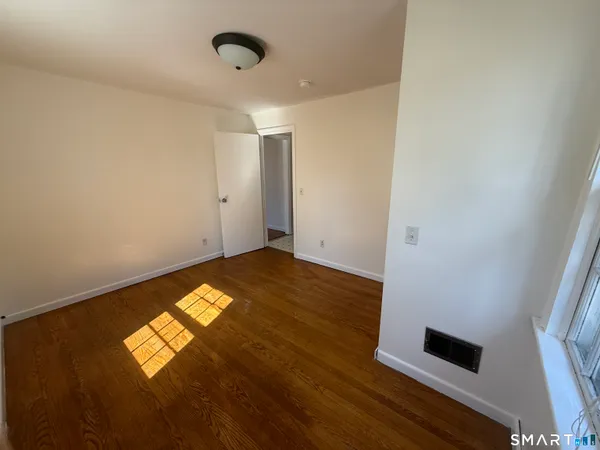 a bathroom with a black and white checkered floor