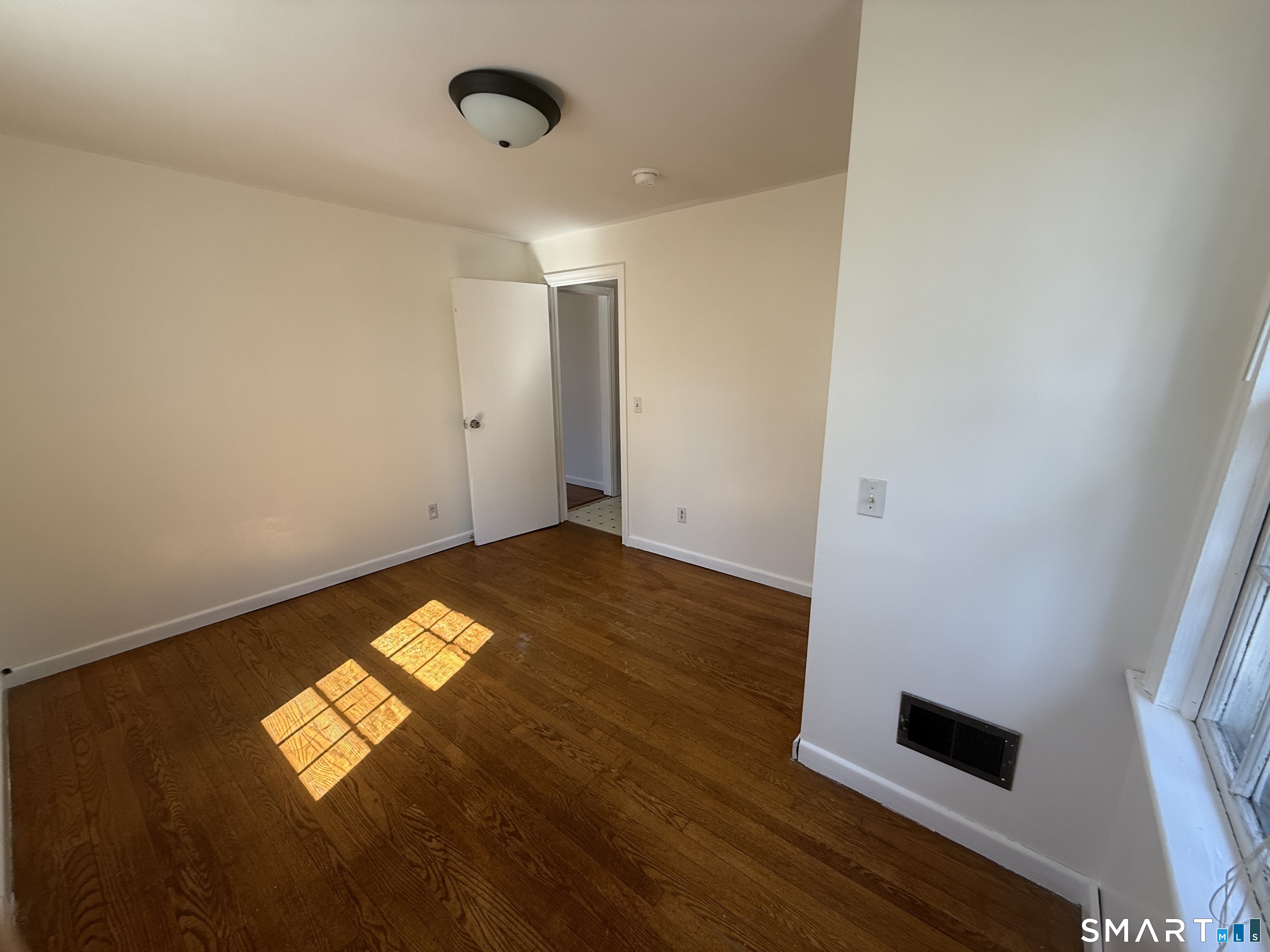 29 North Hill Road North Haven, CT 06473 - Photo 12 of 14 a view of empty room with wooden floor