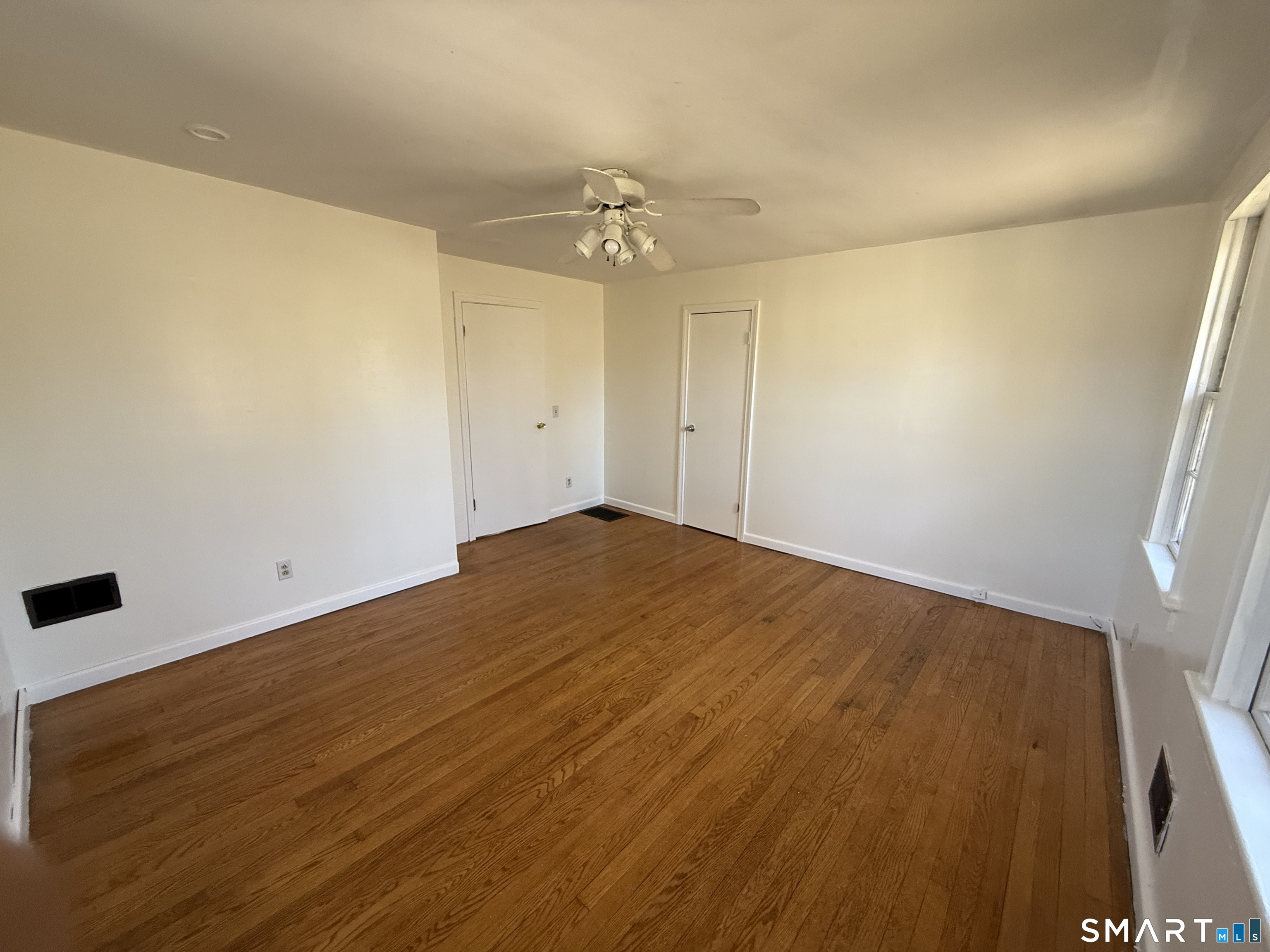 29 North Hill Road North Haven, CT 06473 - Photo 4 of 14 a view of empty room with wooden floor