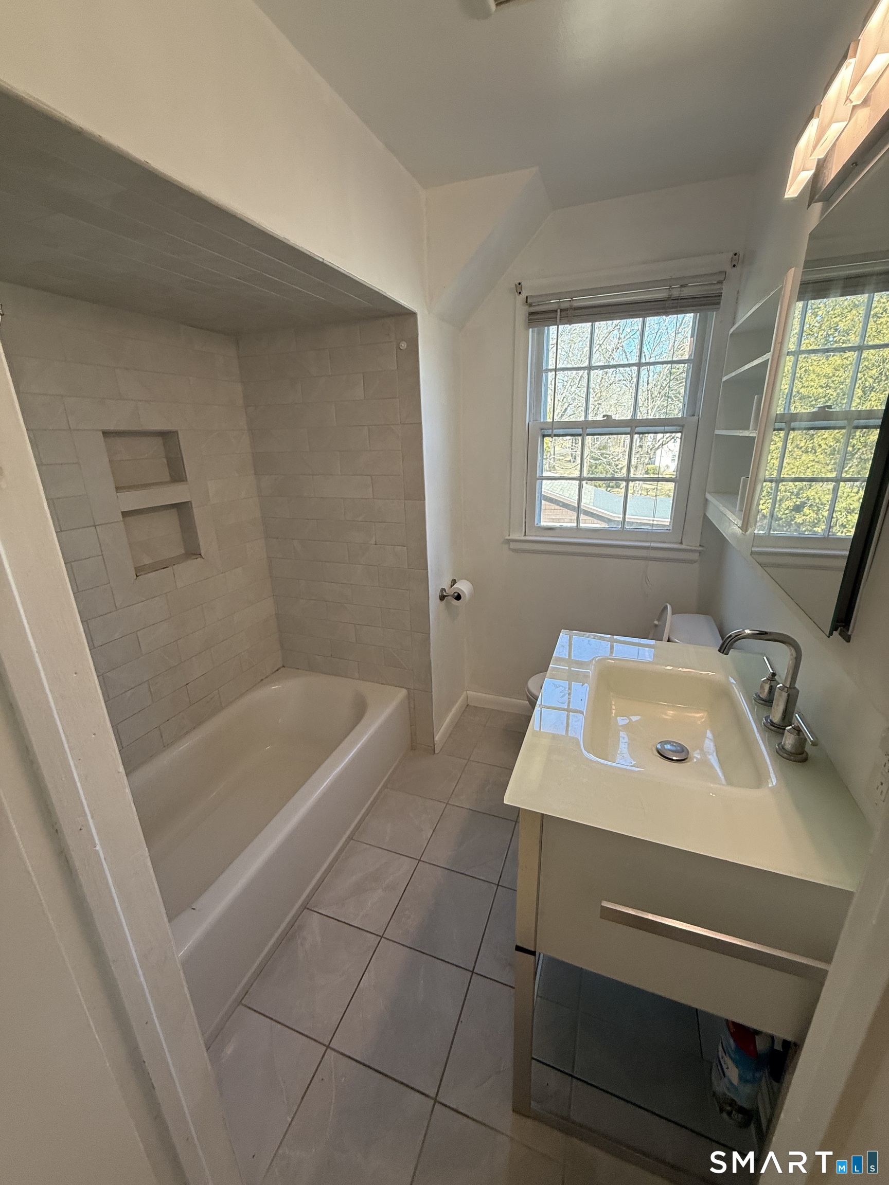 29 North Hill Road North Haven, CT 06473 - Photo 5 of 14 a bathroom with a sink a toilet a window and bathtub