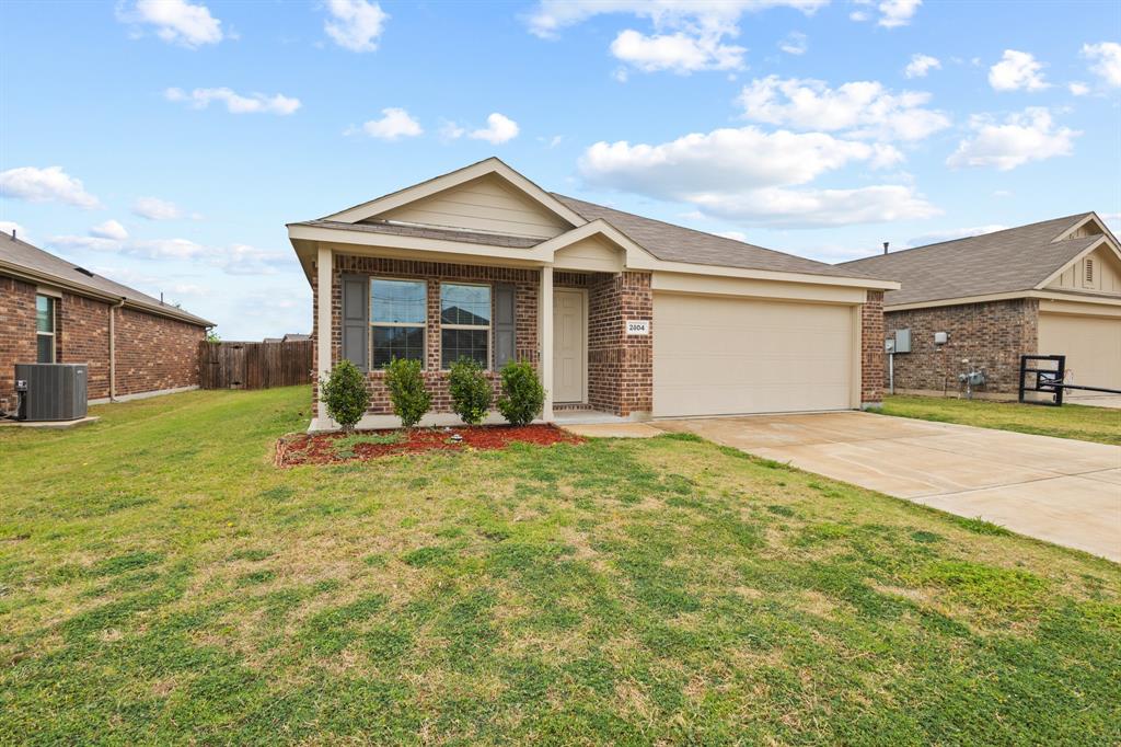 2604 Spring Time Drive Ennis, TX 75119 - Photo 2 of 21 a view of a house with backyard and porch