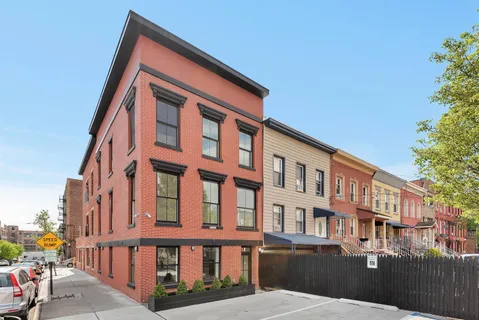 a front view of a building with many windows
