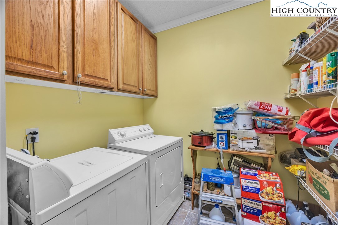 3786 Peak Road Creston, NC 28615 - Photo 17 of 31 a utility room with dryer and washer
