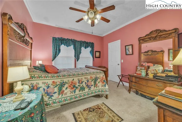 a bed room with a bed and a chandelier