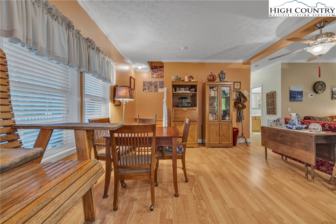 3786 Peak Road Creston, NC 28615 - Photo 25 of 31 a view of a dining room with furniture and wooden floor