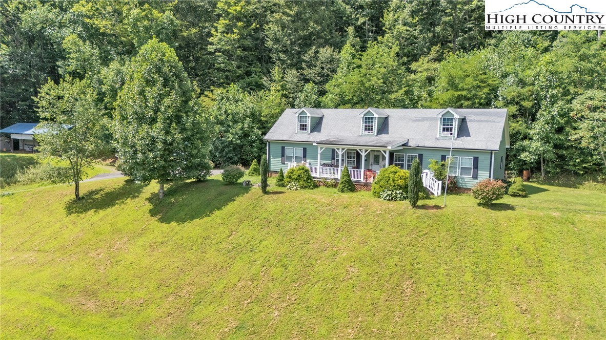 3786 Peak Road Creston, NC 28615 - Photo 43 of 44 a view of a house with pool and chairs